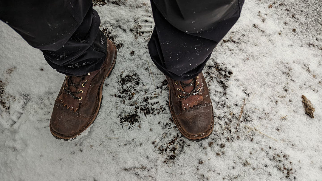 POV tough leather work boots in the snow