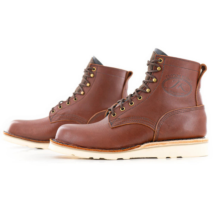 side profile view of the Forefront - Redwood showing the vamp and laces structure.
