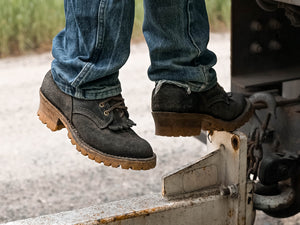 Construction worker covered in dirt in American  Boots