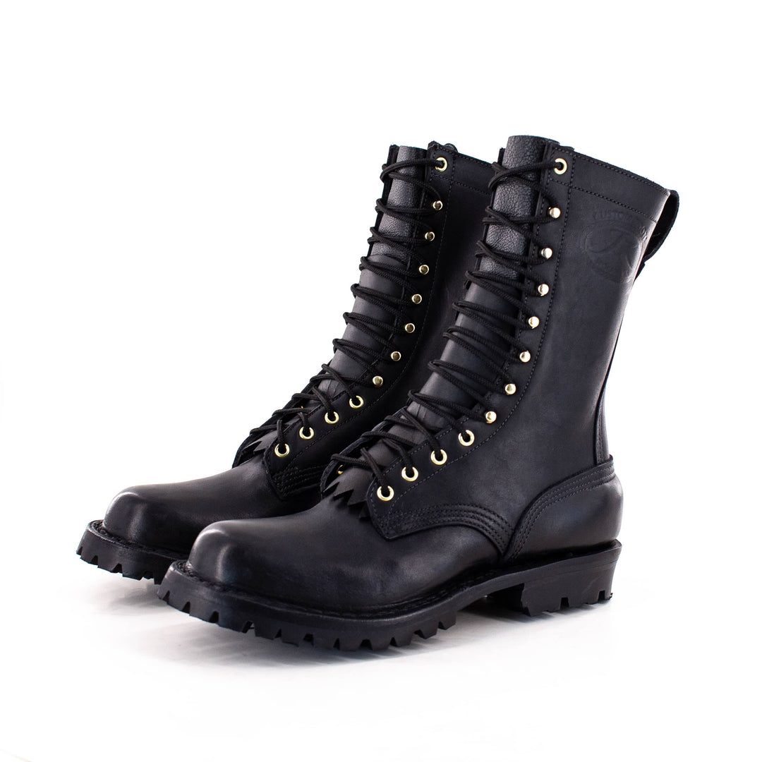 two boots sit side by side, you can see the laces and JK stamp