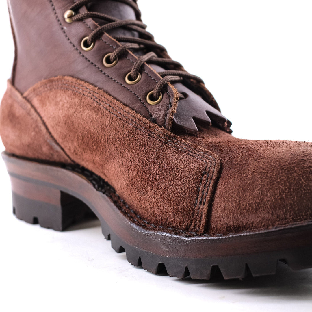 close up image of the Climber - Brown showing the contrast between the smooth/rough leather and the stitching at the sole of the boot.