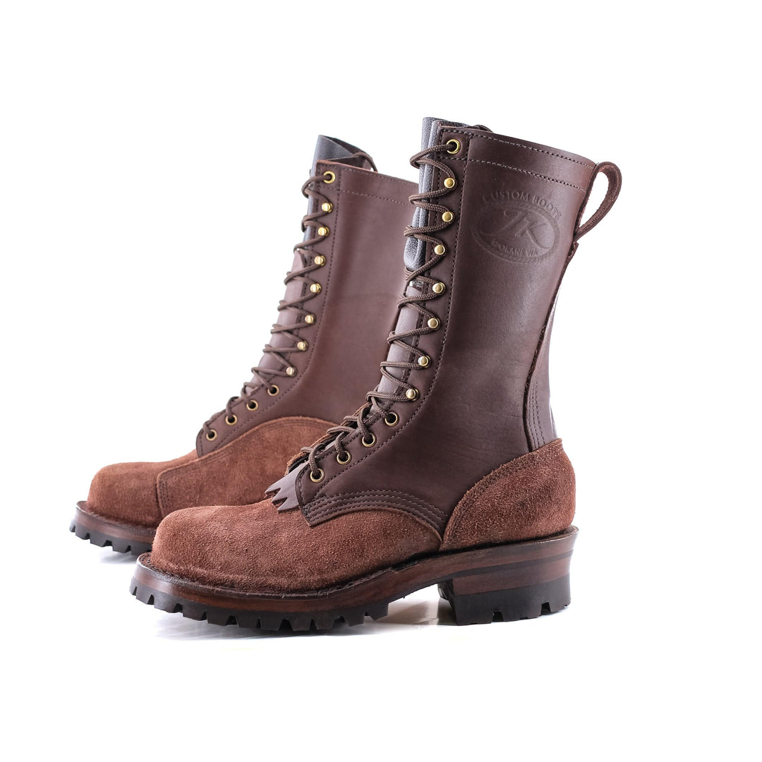 Brown climbers on white background showing the JK stamp and the rough and smooth leather contrast.