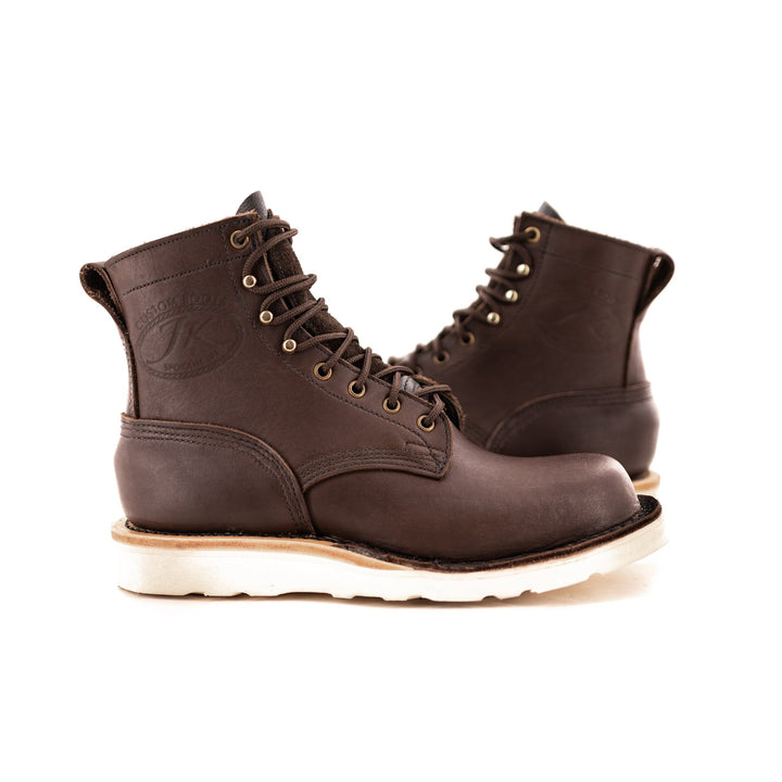 pair of Forefront - Brown sitting side by side showing the design of the boots. you can see the gold eyelets and brown laces.