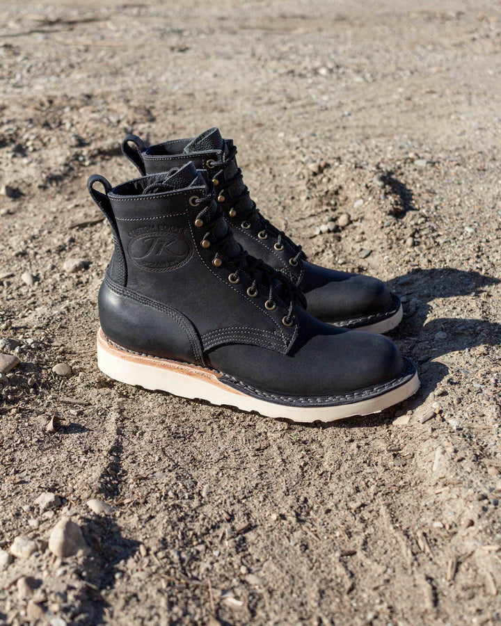 Forefront (Safety Toe) - Black sitting in the gravel showing the contrast of the boot.