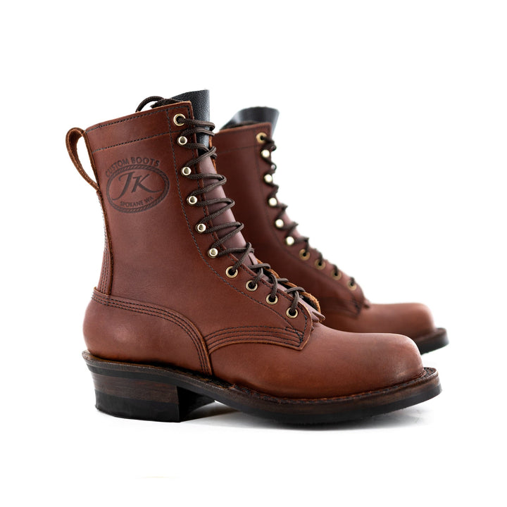 side profile of the Harvester - Redwood showing the overall look of the boot contrasting against a white background.
