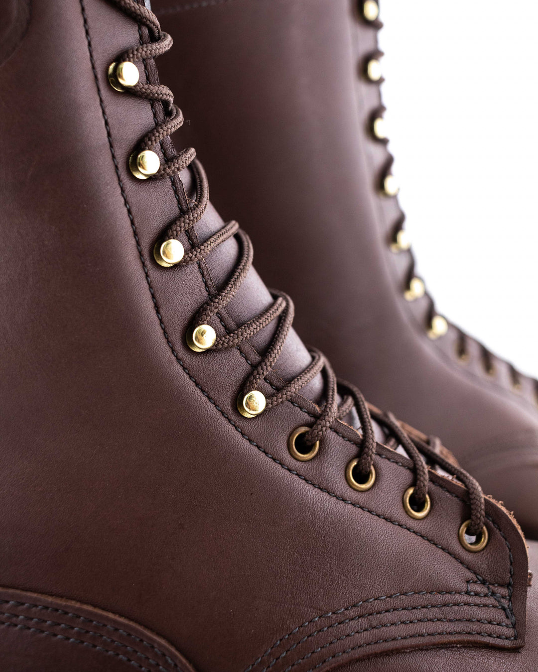 close up of the eyelets, hooks and stitching of the boot